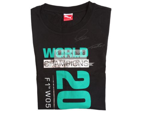 Lewis Hamilton, Nico Rosberg and Niki Lauda signed 2014 F1 t-shirt, their signatures in white marker pen above a WORLD CHAMPI