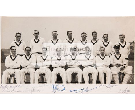 A team-signed photograph of the Australia 1948 'Invincibles' Cricket Team,signed in ink to the lower margin by 14 members of 