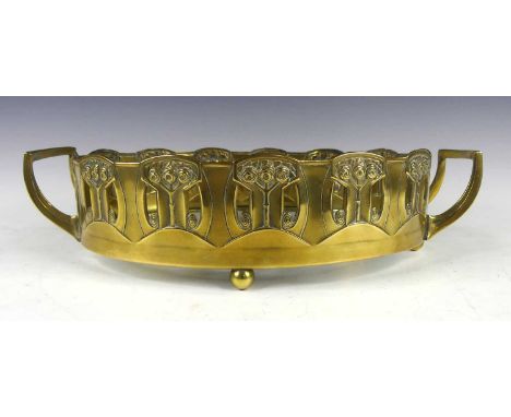 An Art Deco brass oval planter in the manner of WMF, lacking liner, with later inset glass base, all raised on ball feet, unk