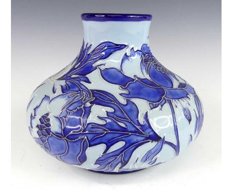 A contemporary Moorcroft pottery bulbous squat vase in the Peony pattern, in tones of blue, designed by Paul Gibson, undergl