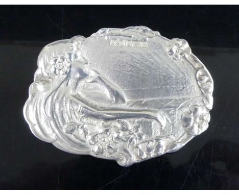 An Art Nouveau silver brooch, of oval shaped outline, decorated with raised female profile portrait within foliage, maker Jon