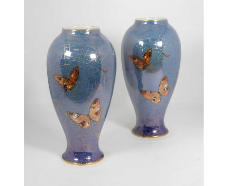 A pair of Art Deco Calrtonware ceramic vases, each decorated with butterflies over a spider's web, h.27cmFree from cracks, ch