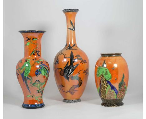 An Art Deco Carltonware orange lustre 'Parrot' pattern ceramic vase, of baluster form, h.27.5cm, together with two further Ca
