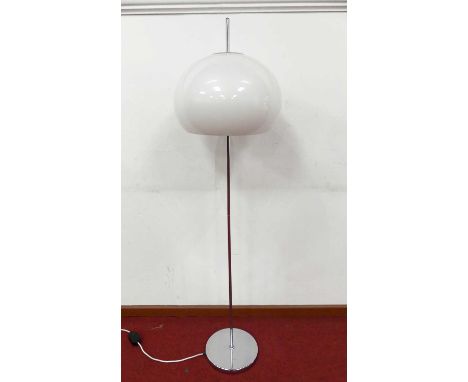 In the style of Harvey Guzzini - a chrome standard lamp, with white perspex domed shade, h.145cm