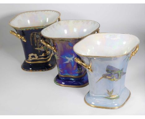 A collection of three Art Deco Carltonware ceramic vases, various colours and patterns, each h.21cmDark blue example – finely