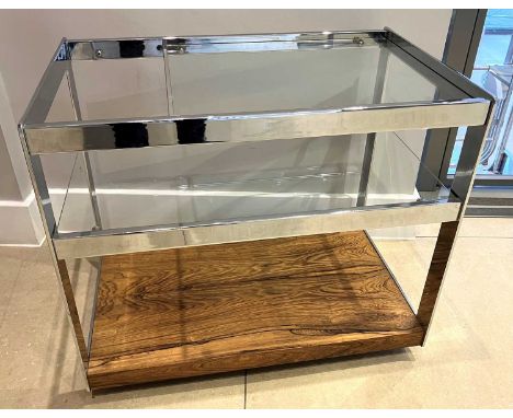 Merrow Associates - a 1960s chrome, rosewood and glass inset three-tier tea trolley, raised on roller castors, of Allen key c