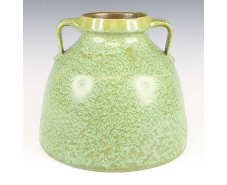 C.H. Brannam - an Art Deco monochrome green painted twin handled pottery bulkhead vase, impressed marks verso, h.21.5cm, base