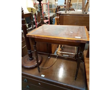 A TABLE AND A STANDARD LAMP