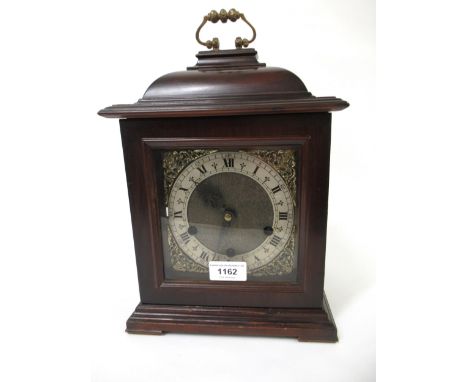 20th Century mahogany cased bracket clock, having brass dial with silvered chapter ring, with a three train Westminster chimi