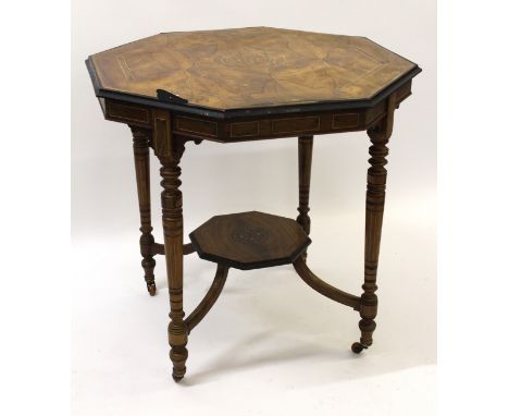 19th Century rosewood inlaid octagonal centre table on turned tapering supports, with undertier and brass and ceramic casters