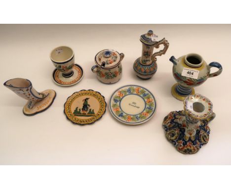 Two small Quimper pottery oil jars, chamber candlestick, large egg cup, boot form vase, two small plates and a preserve pot 