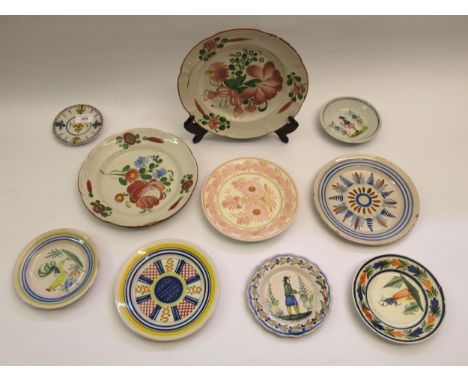 Group of nine various Quimper pottery plates and dishes 