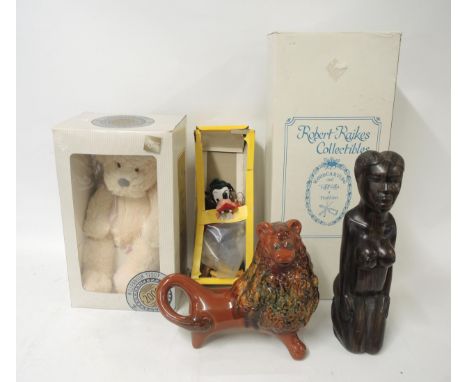 African carved hardwood native figure, together with a boxed Pelham puppet, Goofy, pottery figure of a lion and two boxed ted
