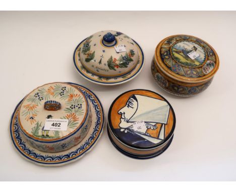 Two Quimper pottery circular covered boxes and two butter dishesPot with seated figure has a crack to bowl and a chip to foot