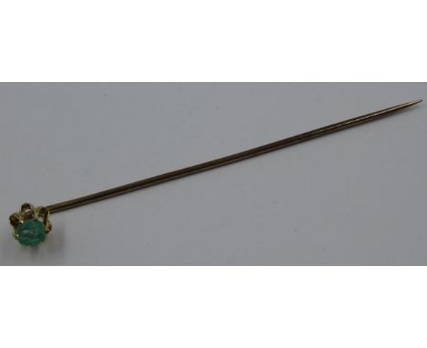Yellow metal stick pin set with emerald, 1g 