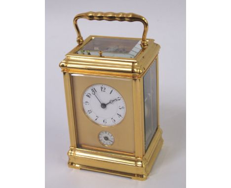 Good quality gilt brass carriage clock, the gorge case enclosing a circular enamel dial with Arabic numerals and subsidiary a