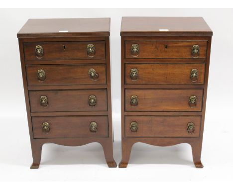 Pair of mahogany four drawer bedside cabinets in Regency style, each with a reeded top above four graduated drawers with bras