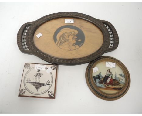 French oak oval tray inset with a carved portrait of a man, inscribed ' Piriou ', together with a small circular reverse prin