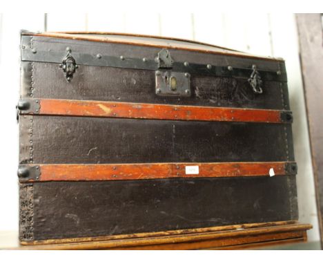 Black canvas and oak trimmed dome top travel trunk with fitted interior, 66cm high x 85cm wide x 50cm deep (lacking key) 