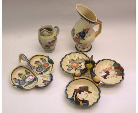 Quimper trefoil dish with dolphin handle, together with a similar smaller dish and two jugs 