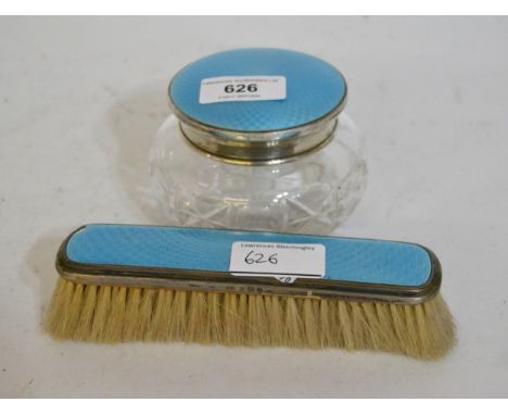 Silver and enamel mounted dressing table jar and a matching brushJar in good condition but brush has chips to edge of enamel.