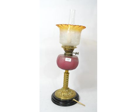 Late 19th Century brass oil lamp, with red and clear glass well (electric conversion)Shade is in good condition but well is d