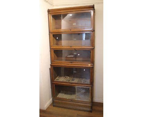 Globe Wernicke oak five section bookcaseMechanisms need putting back into position and cleaning as not running smoothly. Othe