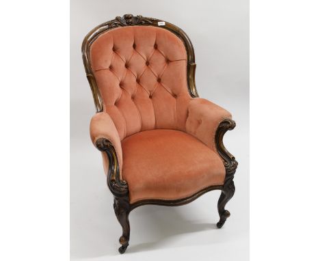 19th Century mahogany button upholstered drawing room armchair on cabriole supports, with brass and ceramic casters, 70cm wid