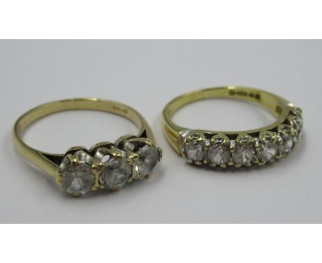 18ct Gold zircon set half hoop ring, 3g, together with a 9ct gold three stone zircon ring, 2.1g 