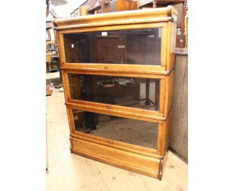 Oak Globe Wernicke three section bookcase with glazed doors, 87cm wide x 31cm deep x 120cm highpolish finish is slightly blot
