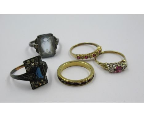 Two 9ct gold ruby and diamond dress rings, sizes L and M, together with an unmarked eternity ring and two silver ringsWeight 