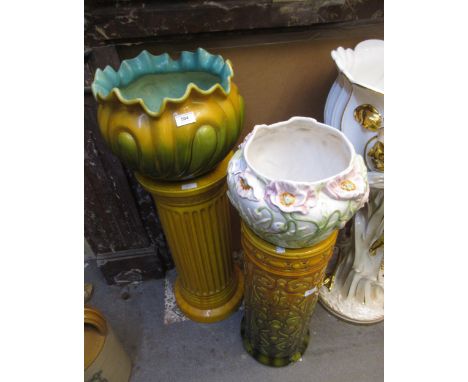 Pottery jardiniere on a fluted stand, together with a Bretby pottery stick stand (at fault) and a modern pottery jardiniereAl