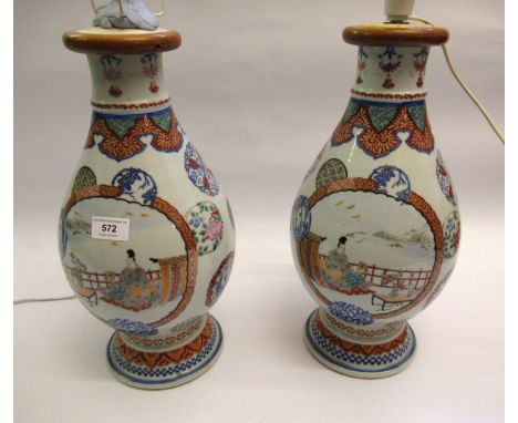 Pair of Japanese enamel decoration baluster form vases, converted to table lamps, decorated with panels of figures in landsca