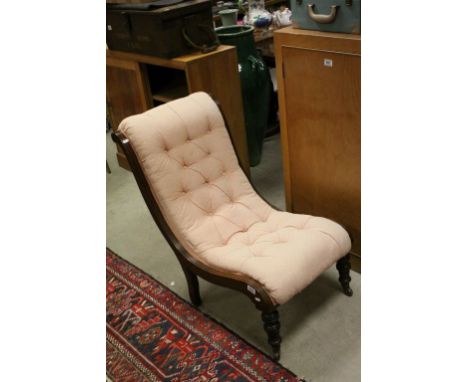 Victorian Mahogany Scroll Framed Chair with Upholstered Button Back and raised on turned front legs and castors