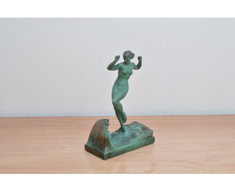 An Art Deco bronzed figure titled 'La Vague', by Raymond Guerbe circa 1925, patinated figure of young female within a wave on