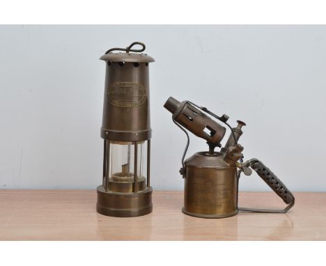 A brass miners lamp,  by E. Thomas &amp; Williams of Aberdare, 26cm high, together with a Swedish brass blow torch (2)