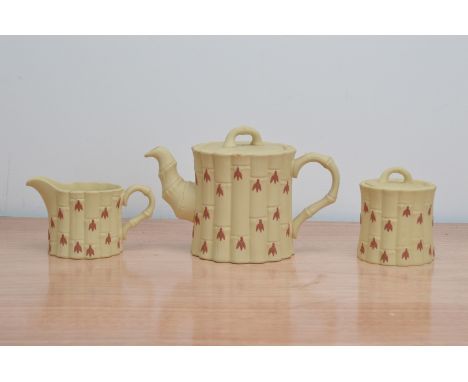 A 20th century Wedgwood primrose bamboo tea set, comprising a teapot with lid, sugar bowl with lid and cream jug (3)