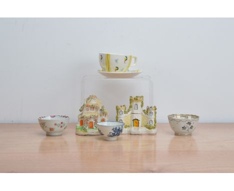 A collection of English ceramics, comprising, a Staffordshire slip vase, and a model house, an early 19th century blue and wh