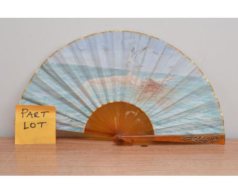 Three early 20th century fans, comprising an art deco example, with gold decoration and hand painted leaf of a reclining lady