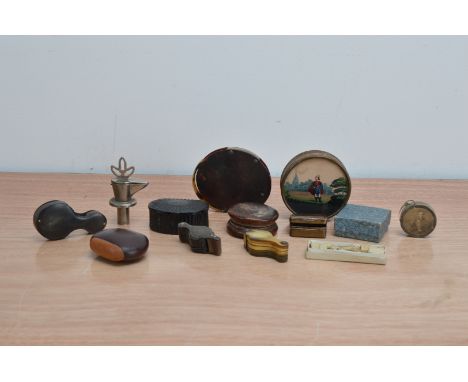 A collection of works of art, comprising, loops and magnifying glasses, a metal wine spout, early 20th century tape measure, 