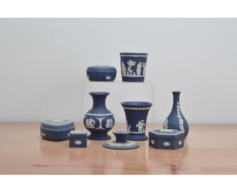 A collection of 20th century Wedgwood Jasperware items, comprising four covered boxes of differing sizes and shapes, a bottle