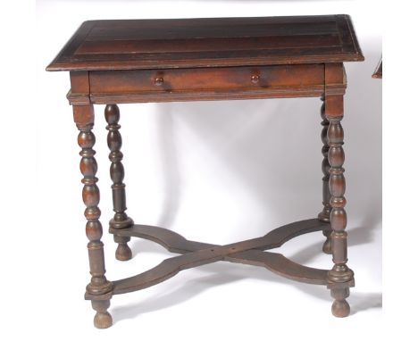 A circa 1700 joined oak single drawer side table, the planked top having a moulded edge, cleated ends, raised on bobbin turne