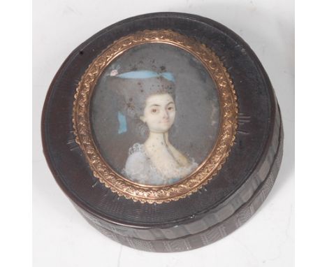 A 19th century French tortoiseshell powder box, having engine turned decoration, the cover set with a watercolour bust portra