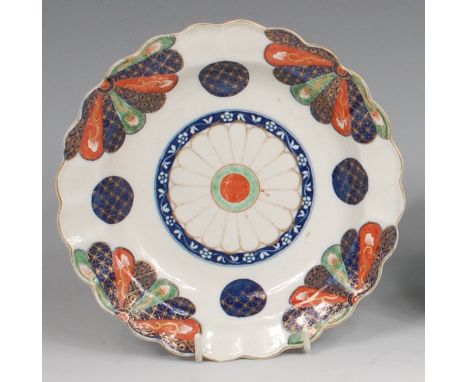 A first period Worcester porcelain tea plate, decorated in the Japanese Fan pattern, pseudo Oriental marks, dia.19.5cm Condit