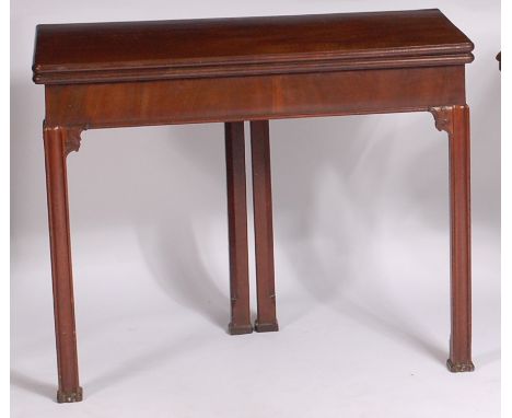 A George III mahogany card table, the fold-over top opening to reveal baize-lined playing surface, on double rear ogee moulde