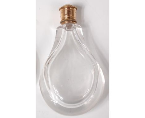 A late 19th century glass ovoid scent bottle, having leaf embossed and finely engine turned yellow metal screw cap, h.9.5cm