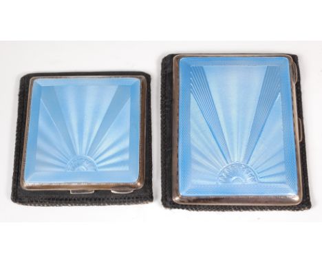 A ladies silver and guilloche enamel powder compact, having mirrored and fitted interior; together with a matching pocket cig