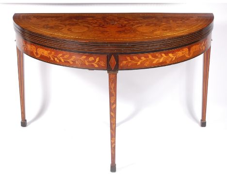 An early 19th century Dutch mahogany and floral marquetry triple leaf tea and card table, the top marquetry inlaid with an ur