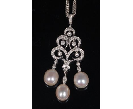 A contemporary 18ct white gold, diamond and pearl three tier pendant, supporting three cultured pearls, each dia. approx 11mm