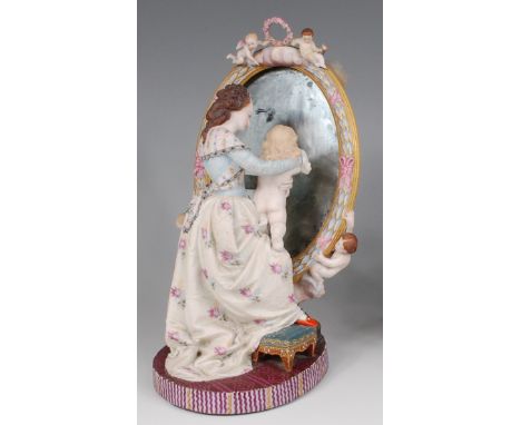 A Victorian George Jones bisque figure group, modelled as a standing maiden and child before a mirror adorned with cherubs, h